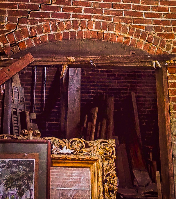 Light filtering through a collapsed brick arch.